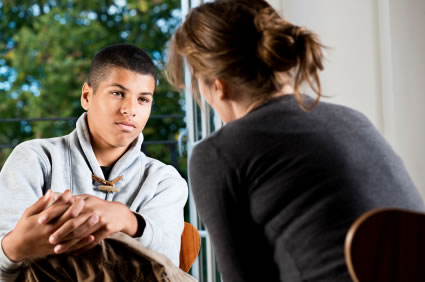 young man talking to counselor